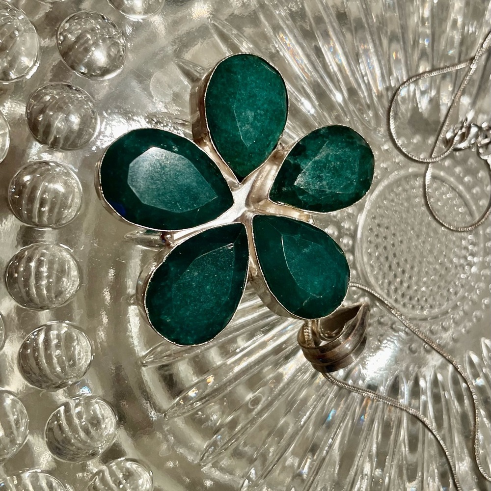Sterling Silver pendant set with emerald composite.